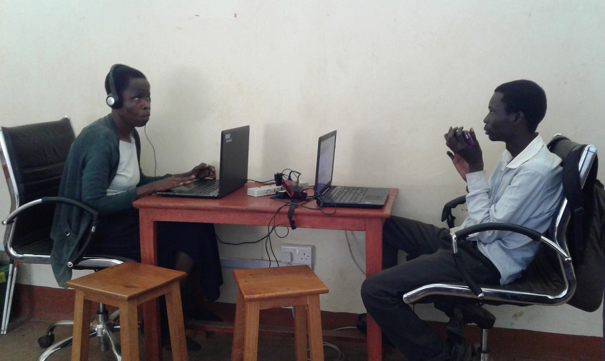 Computer teachers Elizabeth and Jasper prepare for lessons at Oysters & Pearls Uganda office in Gulu.