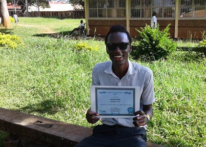 Ralph Musiime holds his 2017 Jaws- Certificate