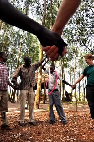 Passing the hulu hoop without breaking hand-holds