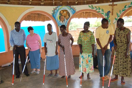 Marilyn Bland teaching community members how to use the white cane