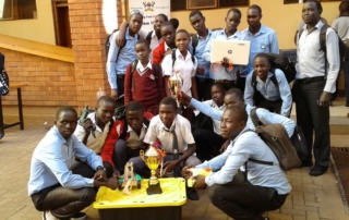Students of Gulu High School and Negri College pose for a photo