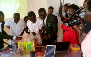 Students of Kiira College Butiiki demonstrate how the Smart Farm works.