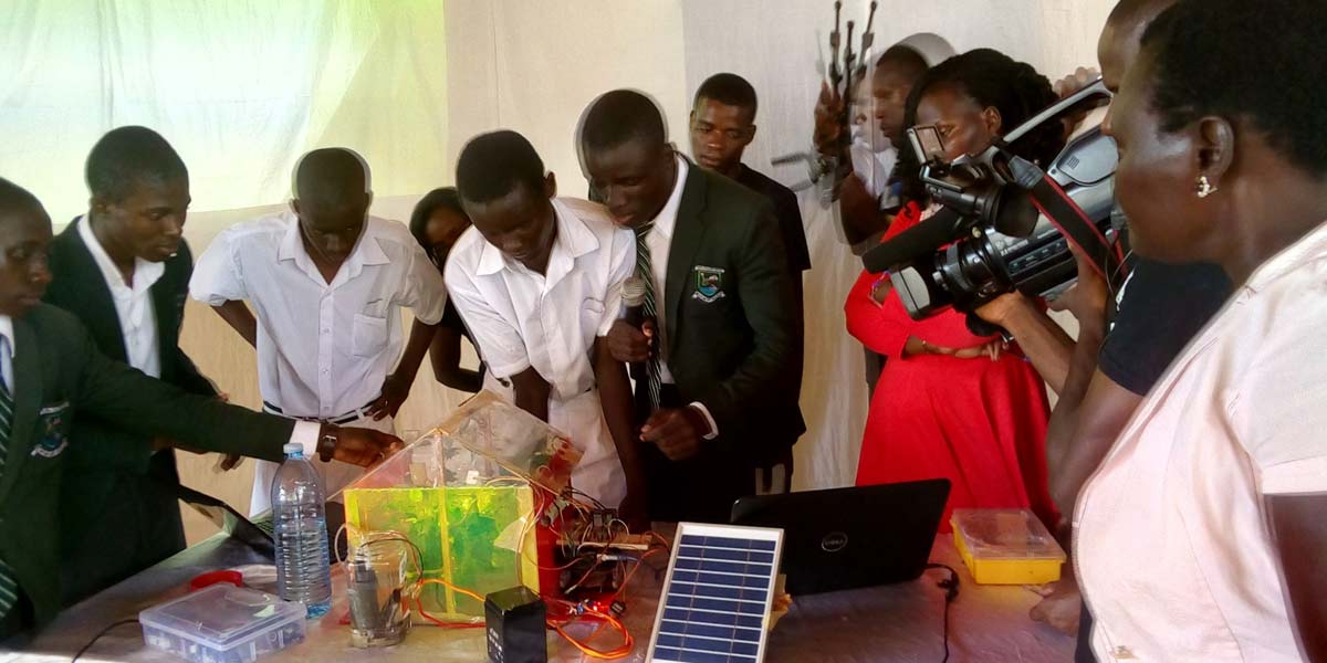 Students of Kiira College Butiiki demonstrate how the Smart Farm works.